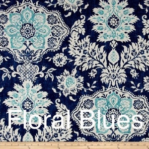 May include: A close-up of a fabric with a repeating floral pattern in shades of navy blue, white, and teal. The text "Floral Blues" is displayed in white across the bottom of the image. The design features stylized flowers and foliage.
