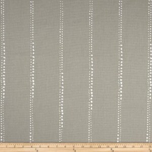 May include: A close-up of a gray fabric with white vertical stripes. The stripes are made up of small white dots.