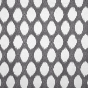 May include: A white and gray fabric with a repeating pattern of large, white, fuzzy circles on a gray background.