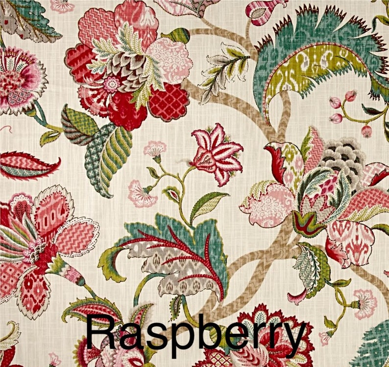 May include: A floral fabric with a cream background and a repeating pattern of pink, red, and green flowers. The text "Raspberry" is printed in black at the bottom of the image.