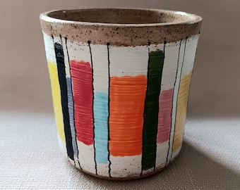 Parallel Pallate of lines and colors on a white background of porcelain over a speckled red clay universal cup planter utensil holder