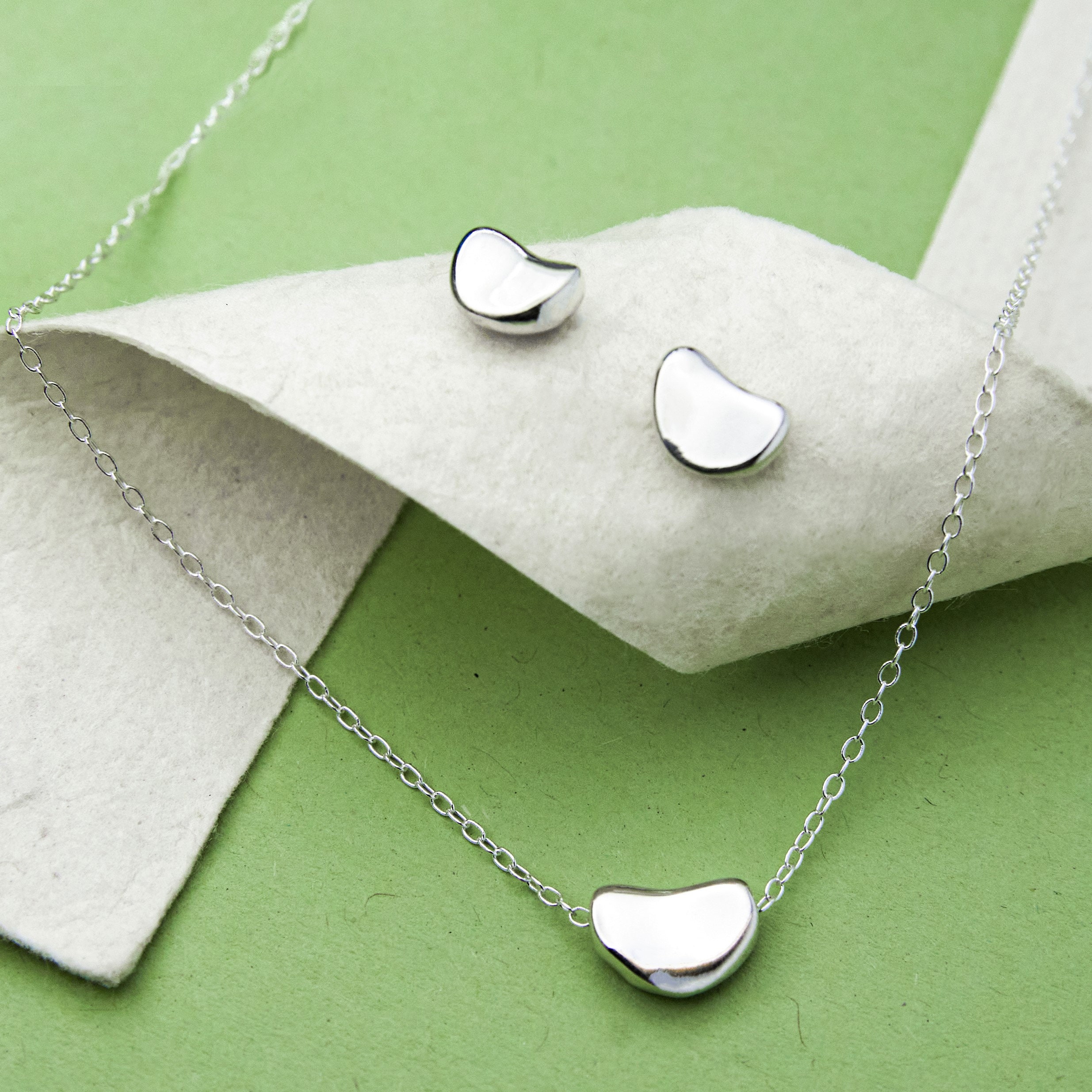 Silver bean best sale necklace