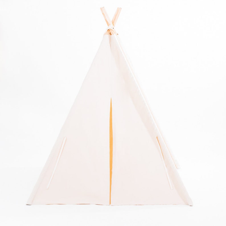 May include: A white canvas teepee tent with a wooden frame. The tent has a flap that can be opened and closed.