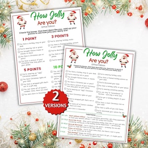 May include: Two white paper game sheets titled How Jolly Are You? Office Edition, featuring Santa Claus illustrations, checkboxes for holiday-themed activities, and point values. A red starburst graphic in the centre displays the text 2 VERSIONS.