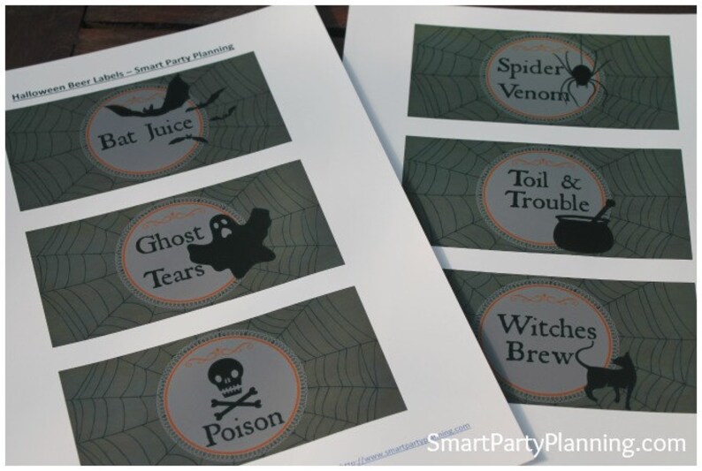 May include: Halloween-themed beer labels with spooky illustrations. Designs include "Bat Juice," "Ghost Tears," "Poison," "Spider Venom," "Toil & Trouble," and "Witches Brew." Each label features a unique graphic and text.