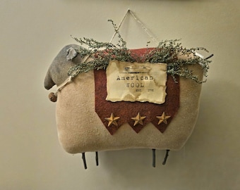 Bill our Primitive Sheep Hanger, carrying a wool felt blanket with rusty stars.