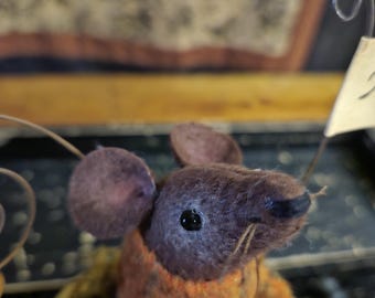 Mozz, our primitive wool felt fall mouse sitting on a prim pumpkin