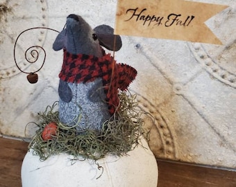 Stilton, our primitive wool felt fall mouse, sitting atop a painted prim pumpkin