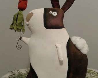 Clancey our very prim easter rabbit, carrying his carrot.