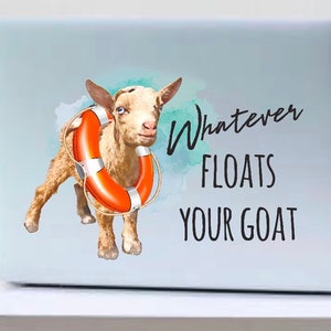 May include: A white laptop with a sticker of a brown goat wearing a red life preserver. The sticker has the text "Whatever Floats Your Goat" on it.