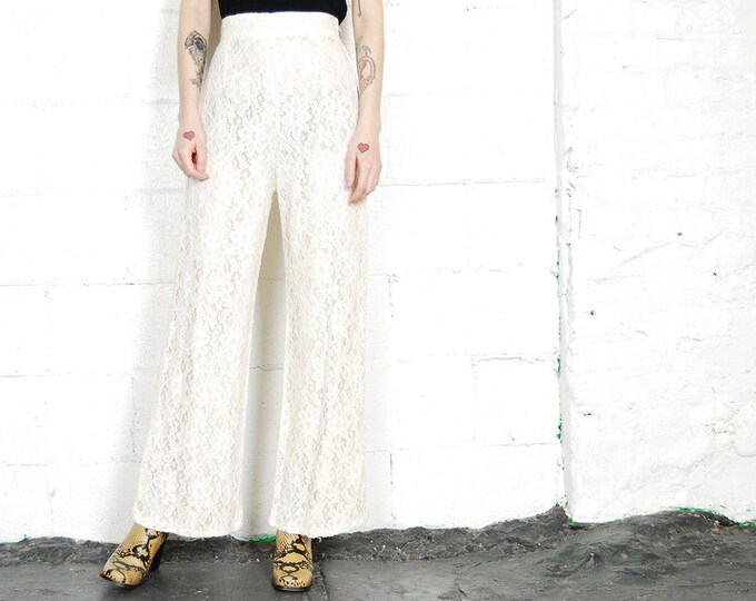 Cream bootcut trousers Clearance