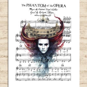 May include: A print of sheet music from "The Phantom of the Opera" featuring a white mask, a theater, and flowing red and burgundy accents. The title and credits are at the top of the print.