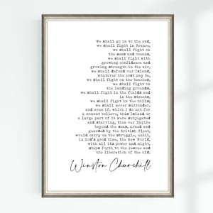 May include: Framed print featuring a quote by Winston Churchill in a typewriter font. The text, in black, is centered on a white background. The frame is a neutral color, suitable for various decor styles.