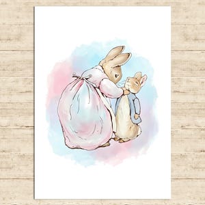 May include: Watercolor illustration of two rabbits, one in a pink dress and the other in a blue jacket. The rabbit in the pink dress holds a large pink sack. The background features soft blue and pink watercolor washes. The artwork is on a white background.