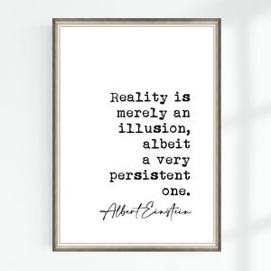 May include: Black and white typography print with a quote by Albert Einstein: "Reality is merely an illusion, albeit a very persistent one."