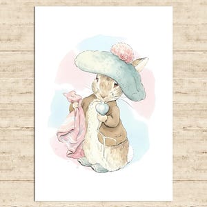 May include: Watercolor illustration of a rabbit wearing a blue hat with a pink pom-pom and a brown jacket. The rabbit holds a pink blanket and a heart-shaped object. Soft pink and blue watercolor washes form the background.