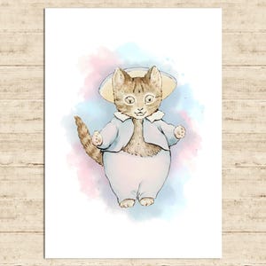 May include: Watercolor illustration of a cat wearing a light blue jacket, pants, and a matching hat. The cat has brown and tan fur and is set against a soft watercolor background of pink and blue.