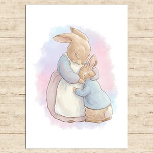 May include: A watercolor illustration of two rabbits embracing. The larger rabbit wears a blue and white dress, while the smaller rabbit is in a blue jacket. The background features soft pink and blue watercolor washes.