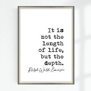 May include: Framed print with the quote "It is not the length of life, but the depth." in black text on a white background. The author's name, Ralph Waldo Emerson, is below the quote. The frame is a neutral gray color.