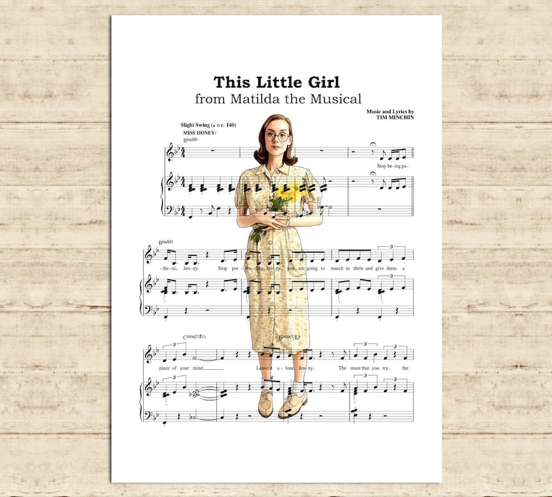 May include: A print of sheet music featuring a woman holding yellow flowers. The text at the top reads "This Little Girl from Matilda the Musical." The woman is wearing a floral dress and glasses.