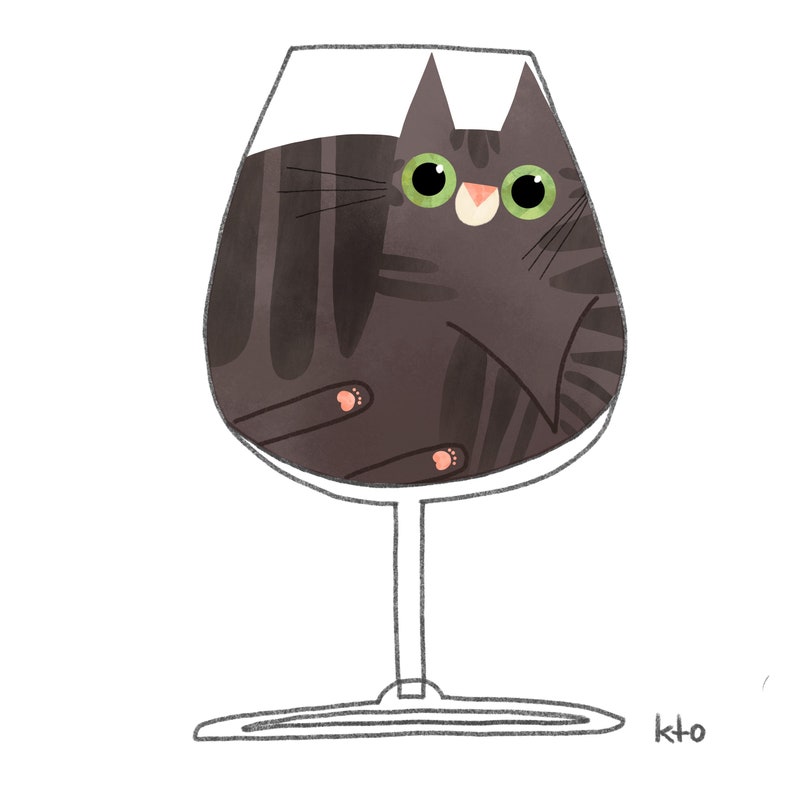 May include: A black cat with green eyes is inside a clear wine glass. The cat is looking at the viewer. The glass is on a white background.