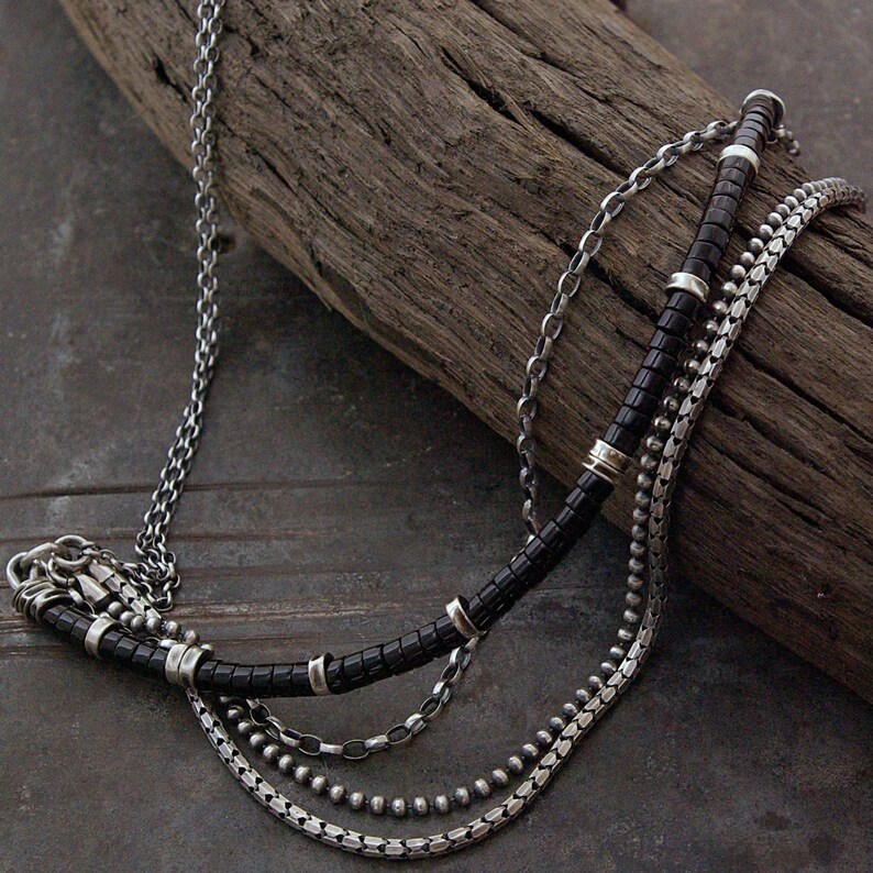 Black Onyx:
Handmade layered boho necklace with black onyx gemstones and oxidized sterling silver. Sleek and grounding, this timeless necklace offers powerful protective energy and elegant style, ideal for daily wear or special occasions.