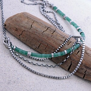 Green Aventurine :
Layered boho necklace handcrafted with natural green aventurine beads and oxidized sterling silver chains. A gemstone known for prosperity and emotional balance, this lightweight artisan necklace is a meaningful everyday piece or thoughtful gift.