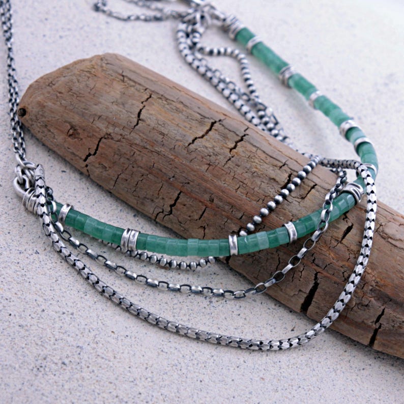 Green Aventurine :
Layered boho necklace handcrafted with natural green aventurine beads and oxidized sterling silver chains. A gemstone known for prosperity and emotional balance, this lightweight artisan necklace is a meaningful everyday piece or thoughtful gift.