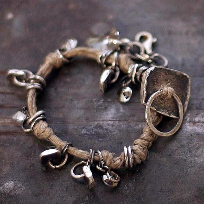 Rustic boho bracelet in natural light, showing the organic combination of linen cord, recycled silver, and Swarovski crystals. Handcrafted slowly with care, this artisan bracelet reflects earthy elegance and quiet luxury. Perfect for minimal, nature-inspired fashion — wearable art that feels soulful, tactile, and timeless.