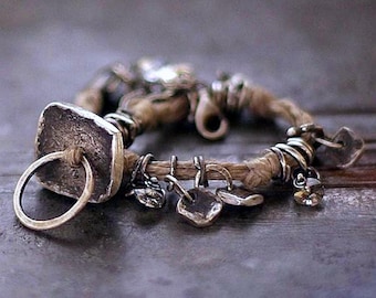 Forged sterling silver bracelet with linen – oxidized silver charms
