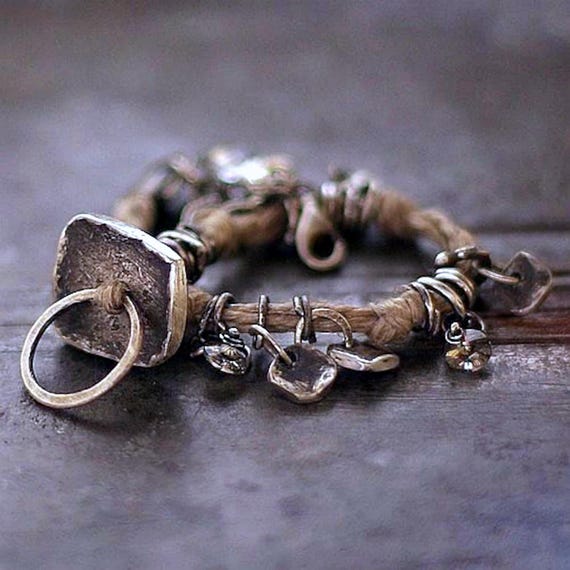 Forged sterling silver bracelet with linen – oxidized silver charms