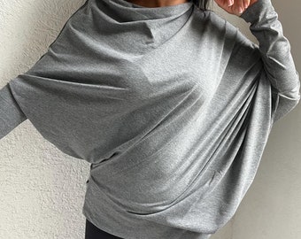 Top asimétrico de manga larga