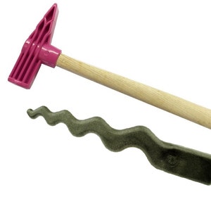 May include: A pink and wooden hammer with a curved head and a green, wavy, textured tool.