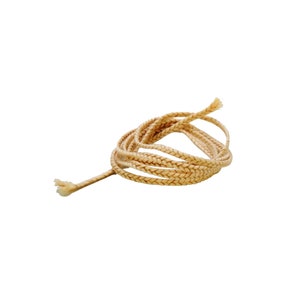 May include: A close-up of a beige braided cord, coiled and tied in a knot.
