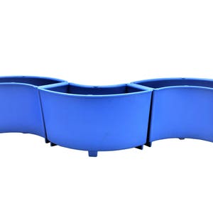 May include: Three blue plastic planters connected together in a curved shape. The planters are designed to be used as a single unit.
