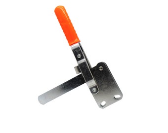 May include: A silver toggle clamp with an orange plastic handle. The clamp has a lever that can be used to secure objects.