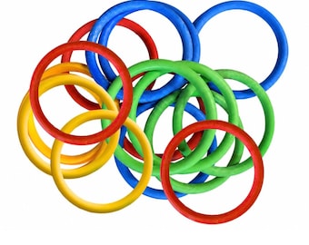 May include: A collection of circular rings in primary and secondary colors including red, blue, yellow, and green. The rings are arranged in an overlapping, scattered pile, creating a cluster of interconnected circular shapes with smooth surfaces.