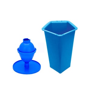 May include: A blue plastic ice cream mold shaped like a traditional ice cream cone with a round base and a pointed top. The mold is sitting on a white surface. Next to the mold is a blue plastic container with a hexagonal shape.