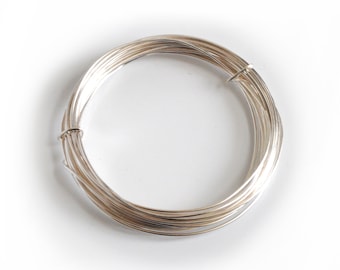 May include: A coil of silver wire, perfect for jewelry making or crafting projects.