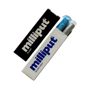 May include: Two tubes of Milliput epoxy putty, one black and one silver grey. The tubes are labeled with the Milliput brand name and the color of the putty.