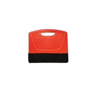 May include: A red plastic squeegee with a black scrubbing pad attached. The squeegee has a handle with a hole for hanging. This tool is designed for cleaning windows and other surfaces.