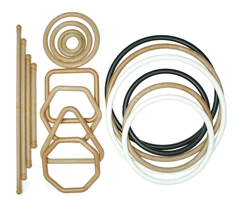 May include: A set of wooden and black rings and handles, some with a square, triangular, and octagonal shape. The rings are of various sizes and are arranged in a pattern.