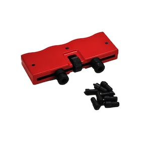 May include: Red watch case opener with a black knob and a set of black watch case opening tools.