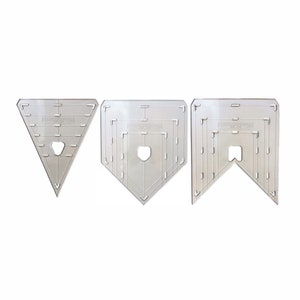 May include: Three clear plastic templates for quilting, featuring a triangle, a baseball diamond, and a banner shape. Each template has multiple lines and markings for precise cutting.