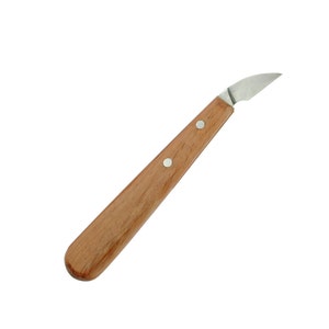 May include: A small, wooden-handled carving knife with a curved blade.