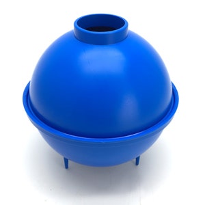 May include: A blue plastic ice ball mold with a round top and three legs.