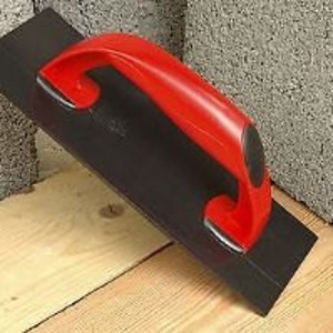 May include: A black and red trowel with a comfortable plastic handle. The trowel is used for smoothing and levelling concrete.