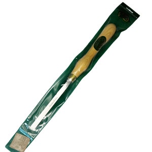 May include: A white wood carving tool with a wooden handle in a green plastic bag. The tool is labeled "Audels Hills".