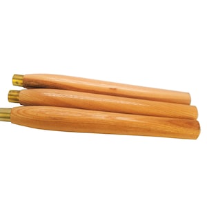 May include: Three wooden chair legs with brass tips. The legs are stacked on top of each other.