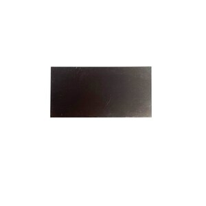 May include: A dark gray rectangular metal sheet.